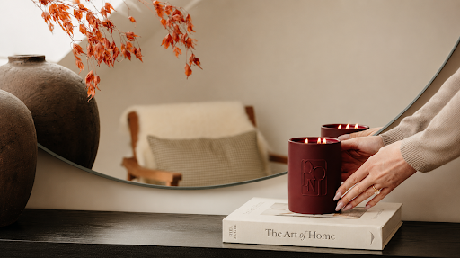 Woman lighting a candle while holding matches